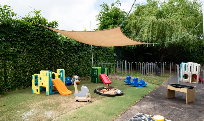 Interactive outdoor activity area with playground equipment at Kiddi Caru Day Nursery Preschool Soundwell Bristol
