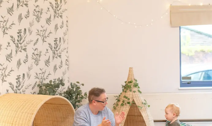 Key worker clapping with child at Kiddi Caru Day Nursery Preschool Coronation Road Downend Bristol