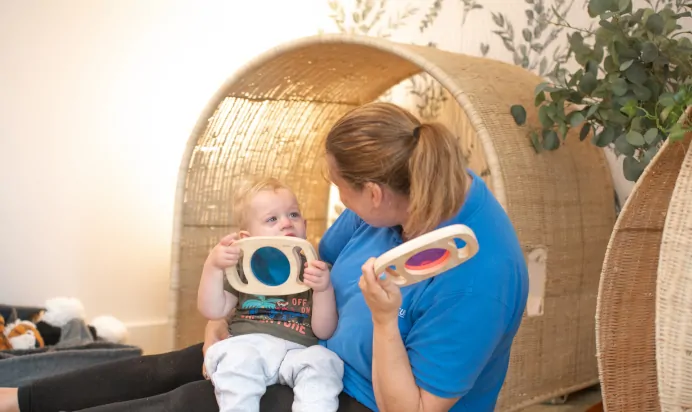 Key worker playing with child at Kiddi Caru Day Nursery Preschool Coronation Road Downend Bristol