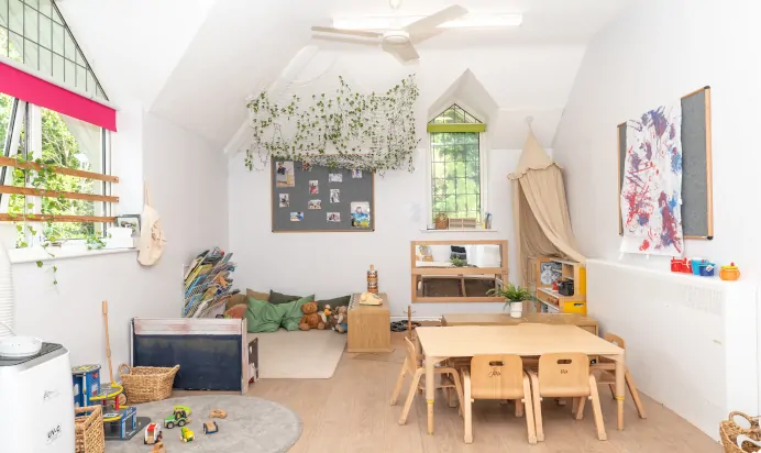 Play space indoors with cosy book corner at Kiddi Caru Day Nursery Preschool Crews Hole Bristol