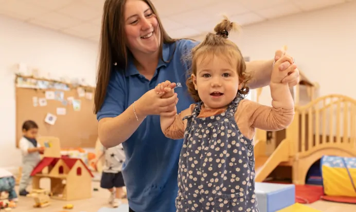 Key worker supporting child at The Elan Day Nursery Haywards Heath