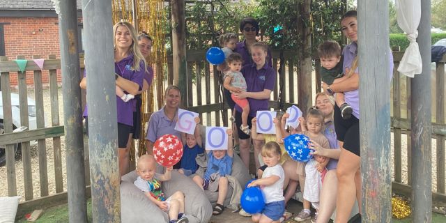 The team and children at Kiddi Caru Day Nursery in Ower, Romsey celebrating their ‘Good’ Ofsted rating.