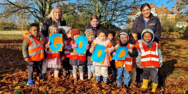 The Head Start Day Nursery & Preschool team and children celebrating their ‘Good’ Ofsted rating.