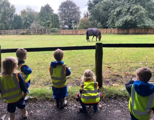 Children watching the horses at Puddleduck Priory Road in Ascot