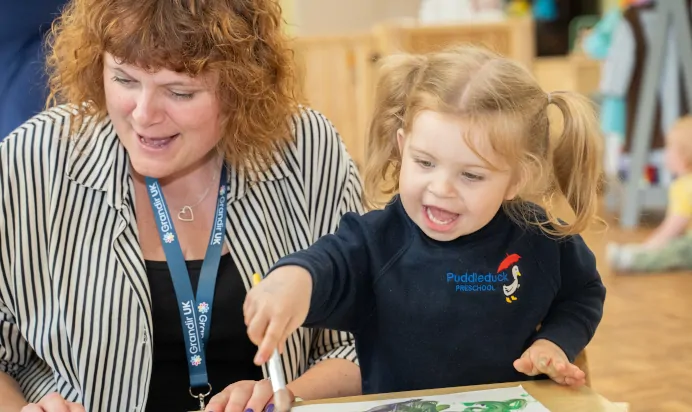 Child learning with key worker at The Puddleduck Day Nursery St Martins Church Ascot
