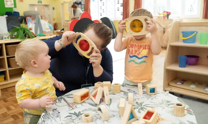 Children playing with key worker at The Puddleduck Day Nursery St Martins Church Ascot