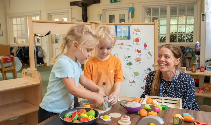 Children playing with toy food at The Puddleduck Preschool Priory Road Ascot