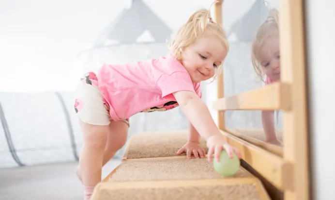 Child playing in interactive space at The College Town Montessori Nursery Preschool Sandhurst