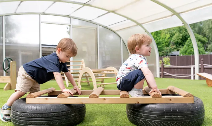 Children playing outside together at The College Town Montessori Nursery Preschool Sandhurst