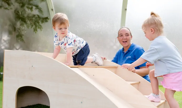 Children playing with key worker at The College Town Montessori Nursery Preschool Sandhurst