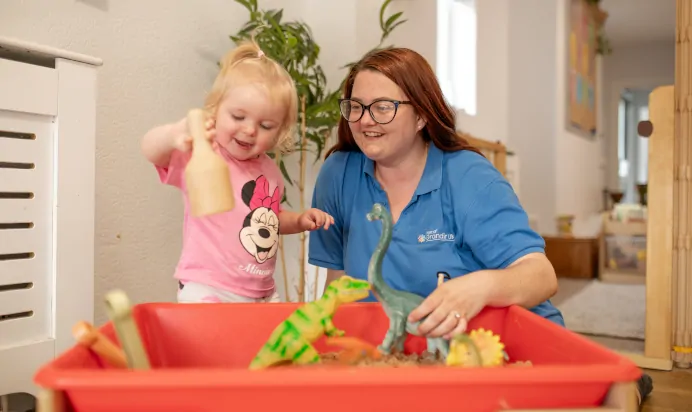 Key worker supporting child at The College Town Montessori Nursery Preschool Sandhurst