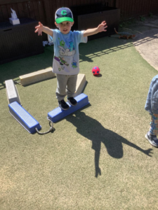 Child at Kiddi Caru Day Nursery & Preschool in Colchester participating in a shadow activity. 