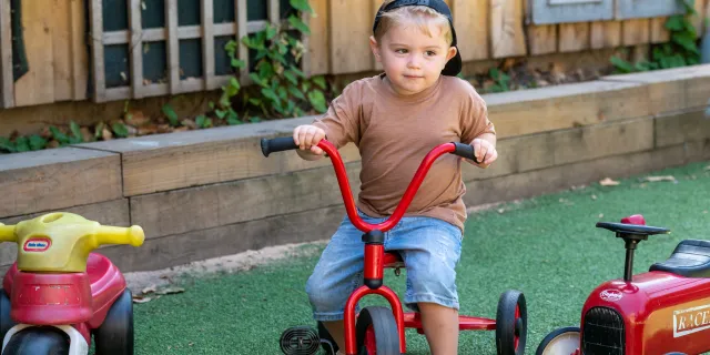 Child on a tricycle at the nursery