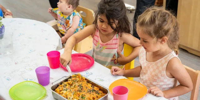 Children having fun making food at nursery